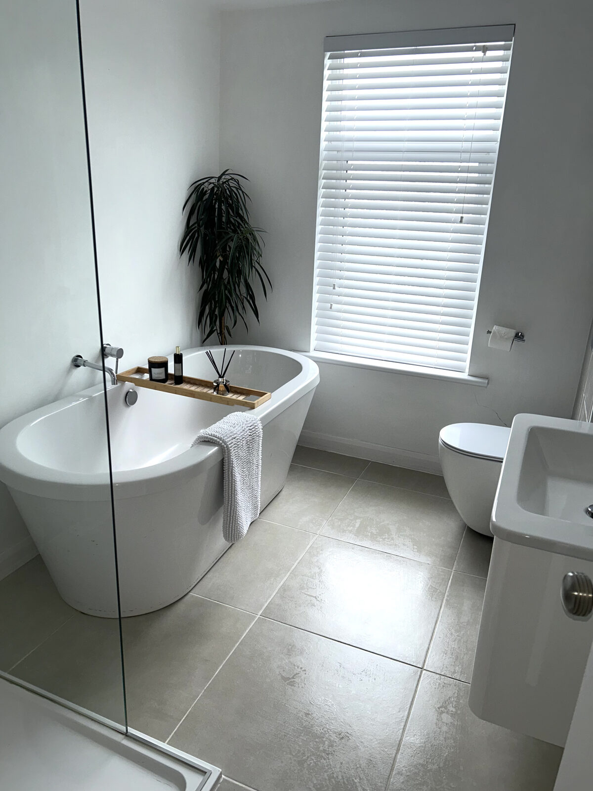 Sparkling clean bathroom with freestanding bath in Wigan