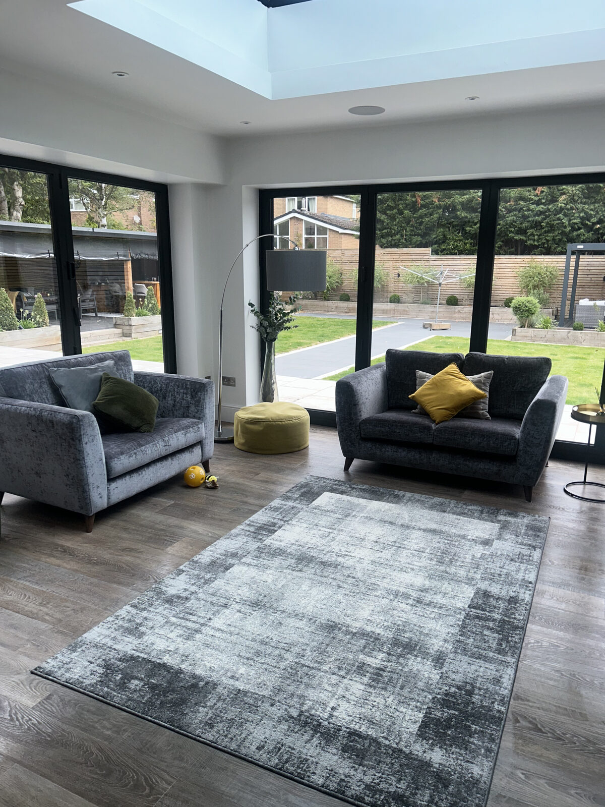 Clean and dust-free living room with bi-fold doors in Wigan